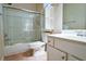 Bathroom featuring a shower-tub combo, tile surround, and vanity with white cabinets at 3082 Monarch Pine Dr, Peachtree Corners, GA 30071