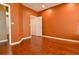 Cozy bedroom featuring hardwood floors, neutral colors, and a doorway to the living area at 3082 Monarch Pine Dr, Peachtree Corners, GA 30071