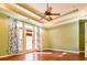 Bedroom featuring hardwood floors, tray ceiling, and natural light at 3082 Monarch Pine Dr, Peachtree Corners, GA 30071