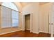 Bedroom featuring hardwood floors, large window and open closet at 3082 Monarch Pine Dr, Peachtree Corners, GA 30071