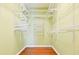 Walk-in closet with custom shelving and hardwood floors at 3082 Monarch Pine Dr, Peachtree Corners, GA 30071