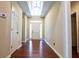 Inviting entryway with hardwood floors, a transom window, and a white front door at 3082 Monarch Pine Dr, Peachtree Corners, GA 30071