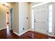 Welcoming entryway with hardwood floors and a bright, white front door at 3082 Monarch Pine Dr, Peachtree Corners, GA 30071