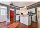 Modern kitchen with white cabinets, a center island, and stainless steel appliances at 3082 Monarch Pine Dr, Peachtree Corners, GA 30071