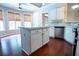 Bright kitchen featuring an island, stainless steel appliances, and hardwood floors at 3082 Monarch Pine Dr, Peachtree Corners, GA 30071