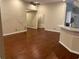 Spacious living room with hardwood floors and view of kitchen bar at 3082 Monarch Pine Dr, Peachtree Corners, GA 30071