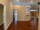 Open concept living area features hardwood flooring and a breakfast bar to the kitchen at 3082 Monarch Pine Dr, Peachtree Corners, GA 30071