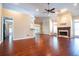 Open living room with hardwood floors, fireplace, and ample natural light at 3082 Monarch Pine Dr, Peachtree Corners, GA 30071