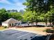 Community pool featuring adjacent parking and mature trees at 3082 Monarch Pine Dr, Peachtree Corners, GA 30071