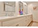 Bathroom featuring double vanities, granite countertops, and modern fixtures at 4476 Paces Battle Nw, Atlanta, GA 30327