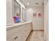 Bathroom featuring double vanities, granite countertops, and decorative mirrors at 4476 Paces Battle Nw, Atlanta, GA 30327