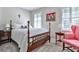 Bright bedroom featuring a four-poster bed, shuttered windows, and colorful artwork at 4476 Paces Battle Nw, Atlanta, GA 30327