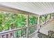 Relaxing patio with table and chairs overlooking lush trees and a wooded yard at 4476 Paces Battle Nw, Atlanta, GA 30327
