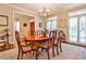 Bright dining room featuring an elegant chandelier, hardwood floors, and ample natural light at 4476 Paces Battle Nw, Atlanta, GA 30327