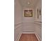 Elevator with decorative wall trim, painting, and wood floor at 4476 Paces Battle Nw, Atlanta, GA 30327