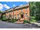Charming brick townhome with a well-manicured lawn and traditional architectural details at 4476 Paces Battle Nw, Atlanta, GA 30327