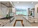Modern kitchen featuring granite countertops, a large island, and lots of natural light at 4476 Paces Battle Nw, Atlanta, GA 30327