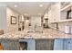 Spacious kitchen with granite countertops, white cabinets, and an island with barstool seating at 4476 Paces Battle Nw, Atlanta, GA 30327