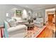 Bright living room with hardwood floors, neutral decor, and French doors to the outside at 4476 Paces Battle Nw, Atlanta, GA 30327