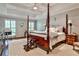 Spacious primary bedroom featuring a tray ceiling, hardwood floors, and abundant natural light at 4476 Paces Battle Nw, Atlanta, GA 30327