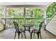 Cozy patio with outdoor table and chairs, perfect for relaxing in a wooded backyard at 4476 Paces Battle Nw, Atlanta, GA 30327