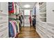 Well-organized walk-in closet with custom shelves and drawers for ample storage space at 4476 Paces Battle Nw, Atlanta, GA 30327