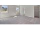 Spacious main bedroom featuring neutral carpeting, natural light, and a walk-in closet at 11 Bennett Farm Dr, Loganville, GA 30052