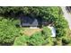 Aerial view of home surrounded by lush trees at 147 Harris Loop, Dallas, GA 30157