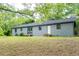 Exterior: View of home with freshly painted siding, backyard with new deck and stairs, and a well maintained lawn at 147 Harris Loop, Dallas, GA 30157