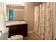 Bathroom with patterned shower curtain, mirror, and toilet at 147 Harris Loop, Dallas, GA 30157