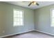 Bedroom with two windows and carpet at 147 Harris Loop, Dallas, GA 30157