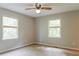 Bedroom with two windows and ceiling fan at 147 Harris Loop, Dallas, GA 30157