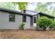 Home exterior showcasing a screened-in porch at 147 Harris Loop, Dallas, GA 30157