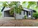 Quaint home featuring an attached carport and screened-in porch at 147 Harris Loop, Dallas, GA 30157