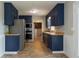 Kitchen with stainless steel appliances and laminate flooring at 147 Harris Loop, Dallas, GA 30157