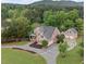 Aerial view of a beautiful brick home with large lot, three car garage, and long driveway at 18 Starlight Dr, Cartersville, GA 30121