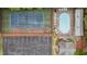 Aerial view of a community pool, tennis courts, parking lot, and trees at 18 Starlight Dr, Cartersville, GA 30121