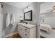 Bright bathroom featuring a granite countertop vanity and decorative mirror at 18 Starlight Dr, Cartersville, GA 30121