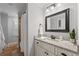 Bathroom with granite countertops, framed mirror, and neutral decor at 18 Starlight Dr, Cartersville, GA 30121