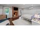 Cozy bedroom featuring a brick fireplace, white trim and doors leading to the backyard at 18 Starlight Dr, Cartersville, GA 30121