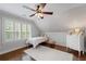 Cozy bedroom with shiplap, natural light, and a ceiling fan at 18 Starlight Dr, Cartersville, GA 30121