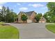 Traditional brick home with a three car garage and a sprawling driveway at 18 Starlight Dr, Cartersville, GA 30121