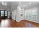 Entryway with hardwood floors, a built-in cabinet with glass doors and a modern entry door at 18 Starlight Dr, Cartersville, GA 30121