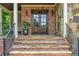 Charming front entrance with stone steps, brick accents, and a welcoming double door at 18 Starlight Dr, Cartersville, GA 30121
