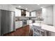 Efficient kitchen featuring white cabinets, stainless steel appliances, and dining space at 18 Starlight Dr, Cartersville, GA 30121