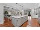 Open kitchen with a large island flowing into the living area with views of the staircase and entryway at 18 Starlight Dr, Cartersville, GA 30121