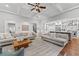 Open concept living room with hardwood floors, coffered ceiling, and seamless access to the kitchen at 18 Starlight Dr, Cartersville, GA 30121