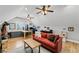 Cozy living room with a red couch, desk area, and natural light creating a relaxing atmosphere at 18 Starlight Dr, Cartersville, GA 30121