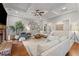 Spacious living room featuring a fireplace, art collection, hardwood floors, and plenty of natural light at 18 Starlight Dr, Cartersville, GA 30121
