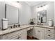 Elegant main bathroom with dual vanities, granite countertops, modern fixtures, and hardwood floors at 18 Starlight Dr, Cartersville, GA 30121